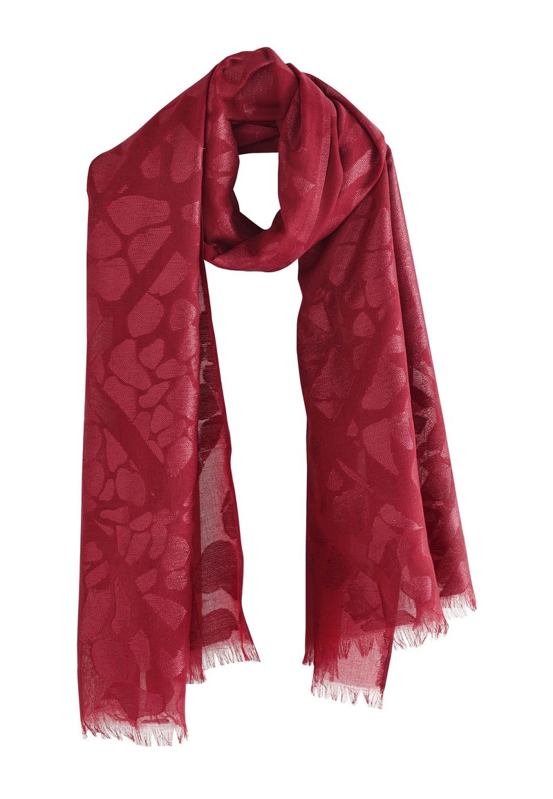 Red scarf made of lightweight fabric featuring a textured pattern. Edges are fringed, and it has a soft, smooth finish.