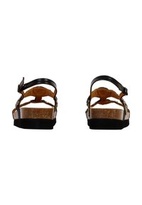 Sandalias negras y marrones con plantilla de corcho, correa ajustable y adornos decorativos en el lateral. Textura suave y diseño de espalda abierta.