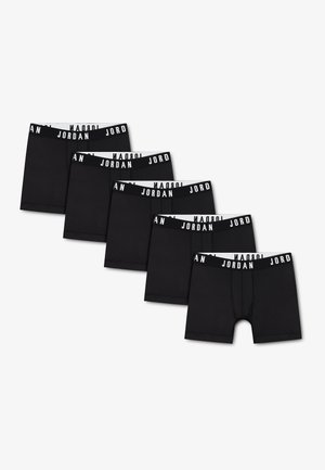 Fem sorte boxer briefs med hvide linninger med ordet "JORDAN" i sorte bogstaver, arrangeret i en forskudt linje.