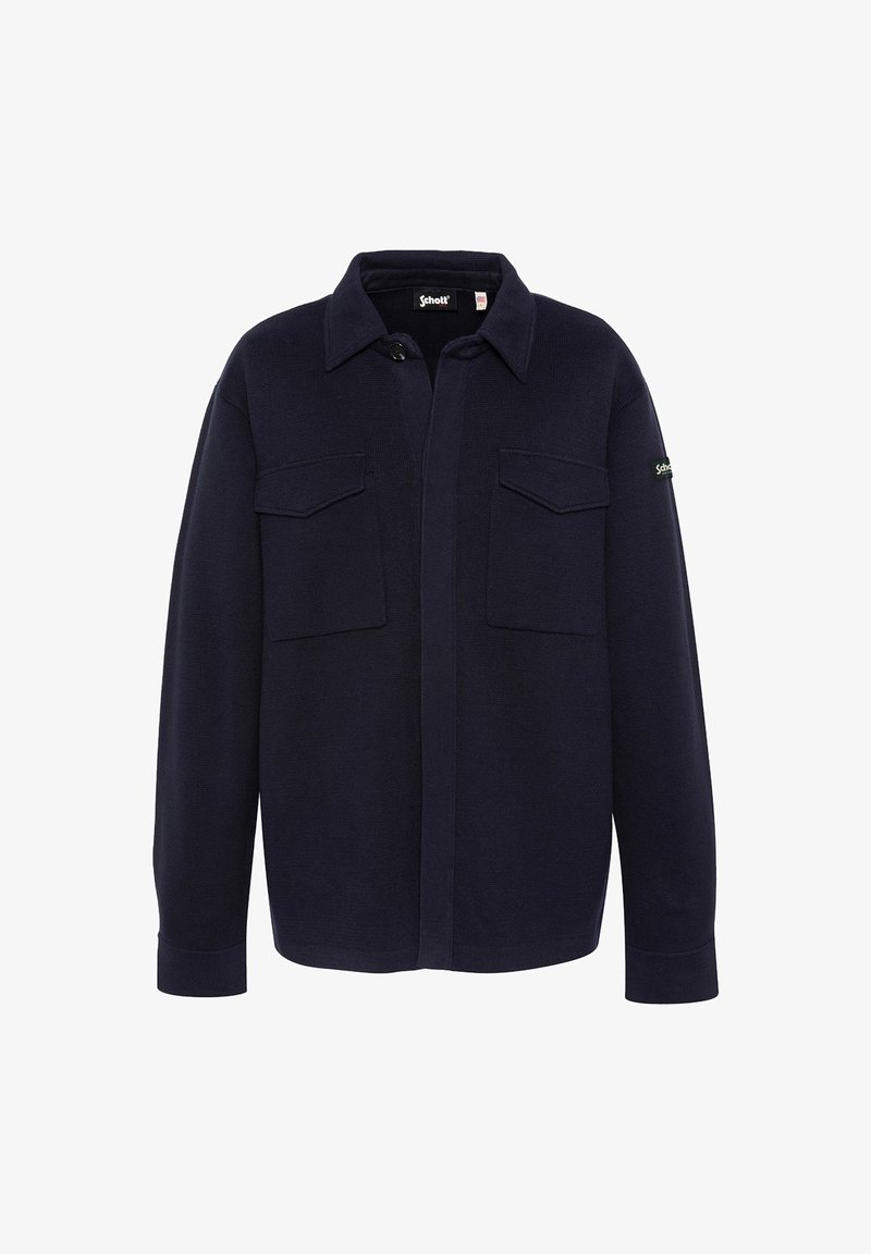 Chemise bleu marine à boutons en tissu texturé, dotée de deux poches avant, d'un col et d'une étiquette logo sur la manche gauche.