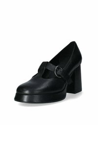 Scarpa nera in pelle con tacco, punta arrotondata, tacco a blocco spesso e una fascia sullo scarpone con un accento metallico circolare.