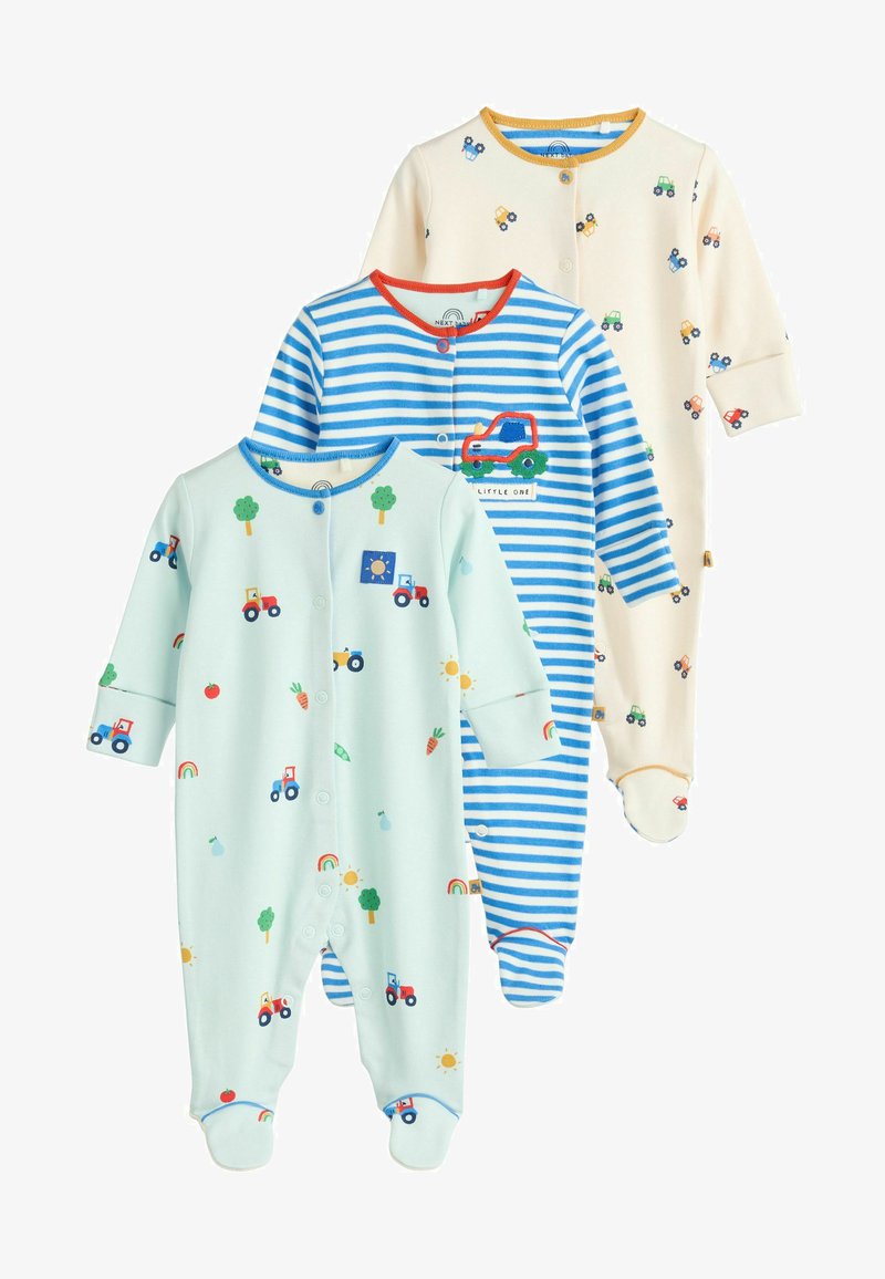 Tre baby heldragter: lyseblå med traktorprint, blå med striber og en lastbilapplikation, samt en cremefarvet med små køretøjsmotiver. Blødt bomuldsstof.