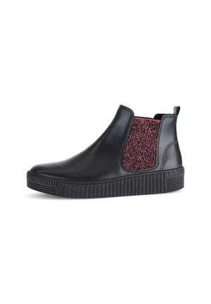 Black leather ankle boot with elastic side panels featuring a textured red design. Thick rubber sole with horizontal grooves for grip.