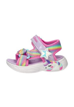 Sandale pour enfants avec des brides arc-en-ciel, un rembourrage violet, une boucle en forme d'étoile, et une semelle blanche ornée d'un design coloré de licorne.