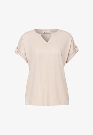 Béžová krátký rukáv halenka s výstřihem do V, zrolované rukávy upevněné knoflíky, vyrobená z lehké látky.