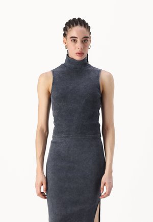 Dark blue ribbed turtleneck top with a fitted design. Features sleeveless cut, smooth texture, and a high neckline.