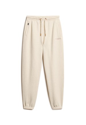 Crème-kleurige joggers van zachte stof, met een trekkoord in de taille, zijzakken en elastische cuffs bij de enkels.