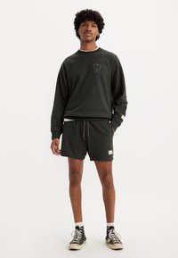 Levi's® PRIDE GRAPHIC UNISEX - Trainingsbroek - pirate black