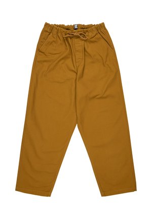 Tan cotton pants featuring an elastic waistband, drawstring closure, two side pockets, and tapered legs. Smooth texture with no visible patterns.