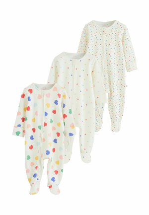 Tri biele detské pyžamá s nožičkami s farebnými vzormi: srdcia, malé hviezdičky a mnohofarebné bodky, každé so zapínaním na zips vpredu.
