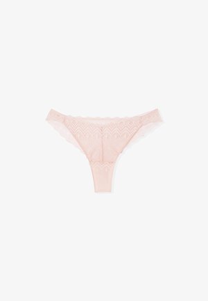 Light pink lace thong underwear with floral patterns and scalloped edges on a white background.