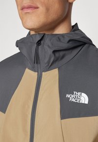 The North Face WIND TRACK HOODIE - Giacca a vento - kelp tan/anthracite grey