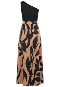 Haut noir à une épaule attaché à une jupe taille haute couleur beige avec de grands motifs abstraits de feuilles noires et une ceinture assortie avec boucle.