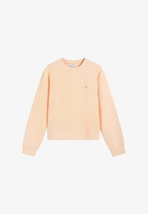 Vaalean persikanvärinen pitkähihainen collegeneule, jossa on resorit hihansuissa ja helmassa sekä pieni kirjailtu pääkallo- ja luurankotunnus rinnassa.