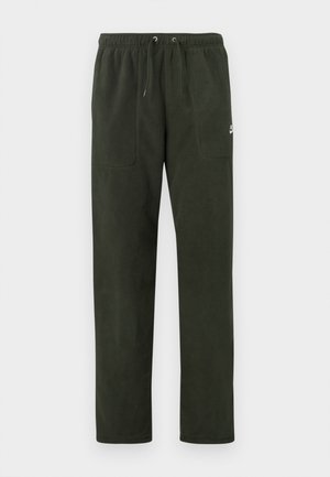 Pantalones de forro polar verde oscuro con cintura elástica, cordón, dos bolsillos frontales y un pequeño logo en el muslo izquierdo.
