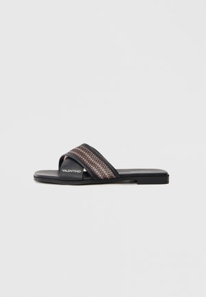 Black slide sandal featuring a cross strap design with a geometric pattern in earthy tones. Made of synthetic material with a flat sole.