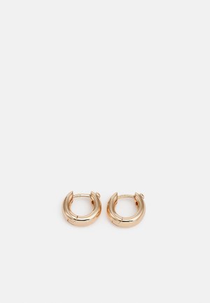 Small chunky gold hoop earrings with hinged clasp, shown side by side on a neutral background.