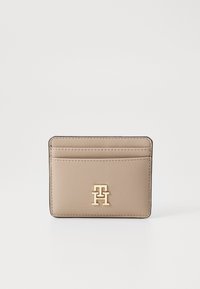 Beige synthetic cardholder with gold-tone logo, featuring multiple card slots and a sleek, minimalist design. Edges are stitched.