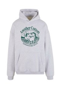 Gray cotton hoodie featuring a front pocket and a graphic design with a cow and text "Another Cotton" in dark green. Adjustable hood.