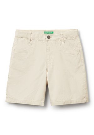 Beige cotton shorts with five pockets, a button closure, and stitched detailing. Features a green brand tag on the waistband.