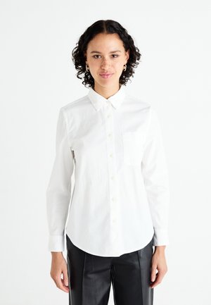 White button-up shirt with a collar, long sleeves, single chest pocket, and a rounded hem. Made of a smooth, lightweight fabric.