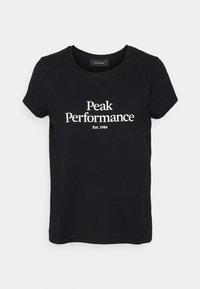 Černé bavlněné tričko s krátkými rukávy a kulatým výstřihem. Na přední straně je nápis "Peak Performance Est. 1986" v bílé barvě.