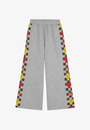 Pantalon gris à jambes larges avec taille élastique, comprenant des bandes latérales à carreaux décorées de visages souriants jaunes, de cœurs rouges et de signes de paix orange.