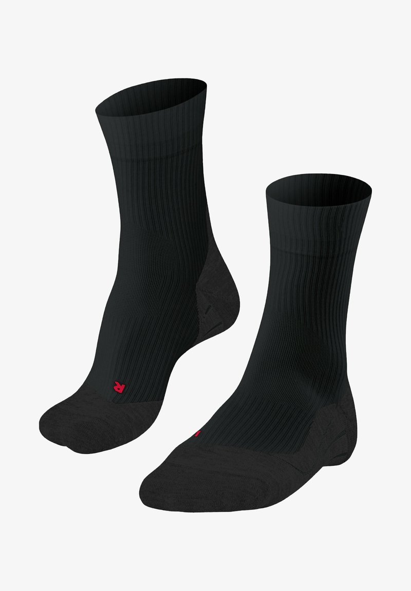 Chaussettes côtelées noires avec un renfort à la pointe et au talon, arborant un petit logo rouge. Le design met l'accent sur la durabilité et le confort.