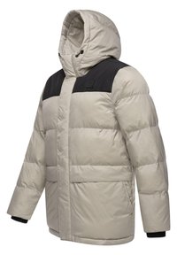 Giacca invernale imbottita con corpo di un leggero beige e pannello nero sulla spalla. Design con cappuccio, tasche laterali e polsini a coste.