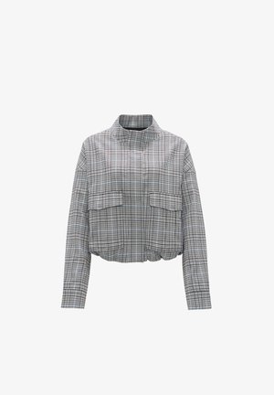 Kurzjacke im schwarz-weißen Karomuster mit hohem Kragen, zwei frontalen Taschen und elastischem Saum für eine taillierte Passform.