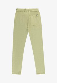 Lichtgroene broek met elastische tailleband, taps toelopende pijpen en een enkele achterzak met een rechthoekige vorm en stikdetail.