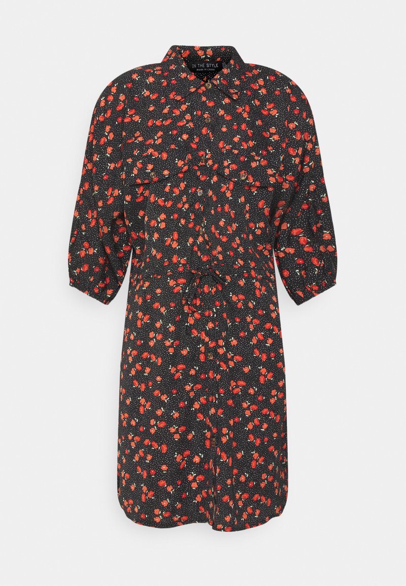 Vestido preto com mangas curtas bufantes, apresentando um padrão florido vermelho sobre um fundo com bolinhas. Inclui colarinho e um design de frente com botões.