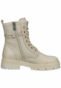 Stivaletti alla caviglia in pelle beige con punta rotonda, allacciatura frontale, cerniera laterale e dettagli testurizzati. Suola in gomma chunky con scanalature.