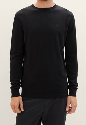 Stickad tröja - black