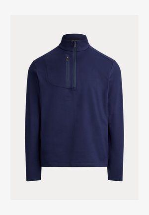 Granatowy półgolf z suwakiem do połowy wysokości wykonany z gładkiego materiału, wyposażony w kieszeń na piersi z zamkiem błyskawicznym oraz długie rękawy. Minimalistyczny design o luźnym kroju.