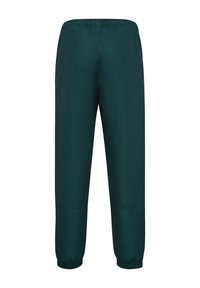 Dunkelgrüne, leichte Hose mit elastischem Bund und gerafften Bündchen an den Knöcheln. Glatte Textur, keine sichtbaren Muster oder Beschläge.