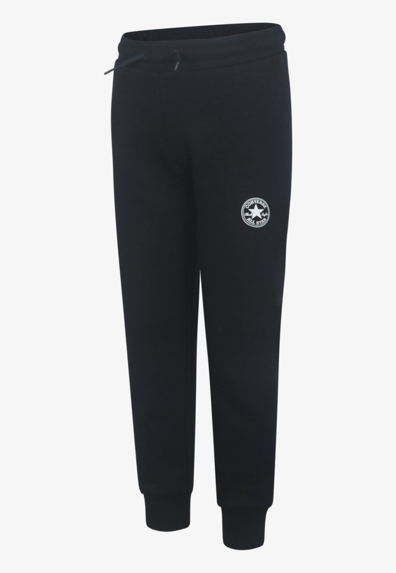 Svarta sweatpants med elastisk midja, dragsko och ribbade muddar. Har en rund vit logotyp på vänster lår.