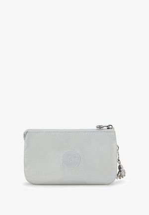 Light gray zippered pouch made of smooth material. Features a circular logo and a silver charm attached to the zipper. Slim rectangular shape.