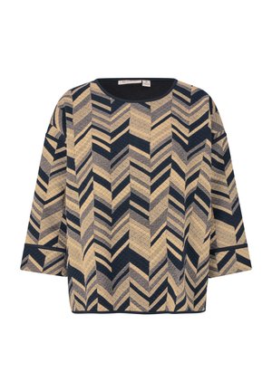 Geweven pullover in beige en marineblauw, met een chevronpatroon. Halflange mouwen en een ronde halslijn. Zachte textuur met een boxy pasvorm.