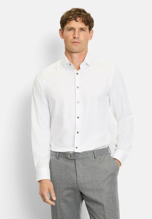 White long-sleeve button-up shirt with a spread collar, featuring gray buttons. Paired with gray trousers. Smooth texture, classic fit.