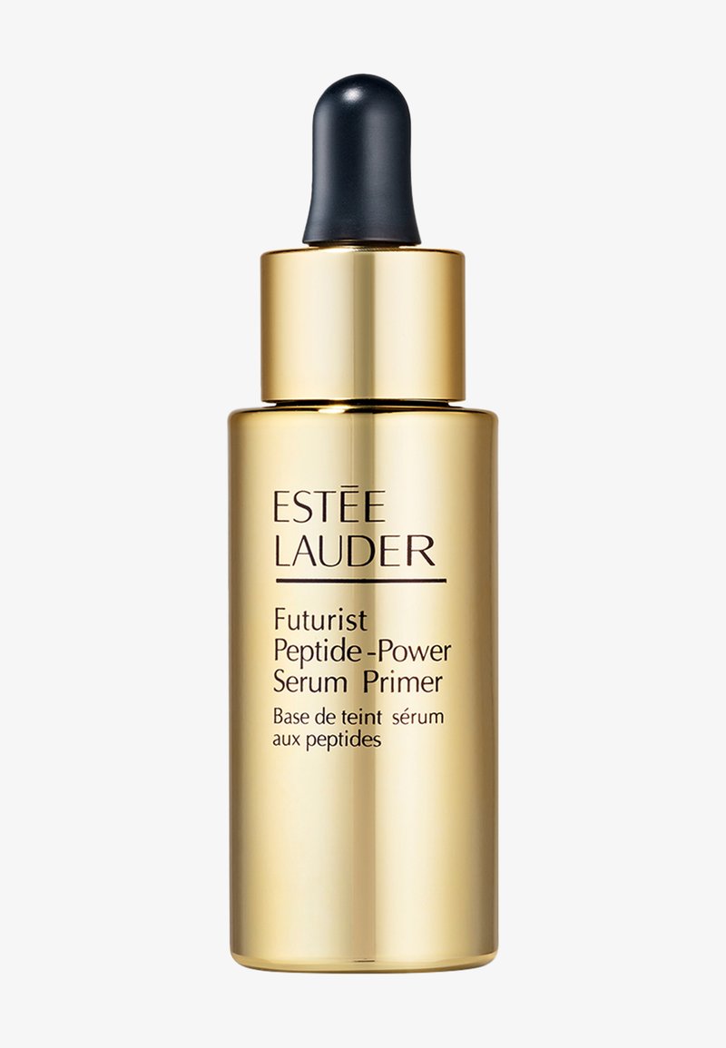Gul flaske med en sort pipette. Etiketten viser "Estee Lauder Futurist Peptide-Power Serum Primer" i sort tekst. Glat metallisk finish.