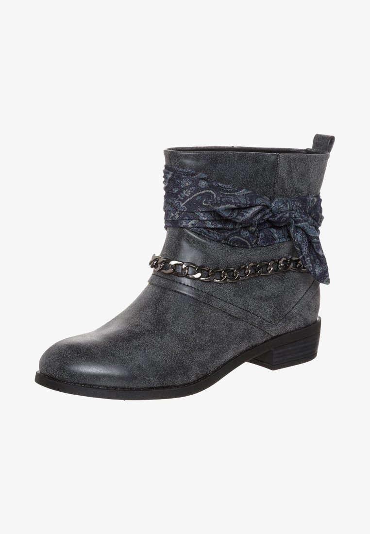 Gray ankle boot with a textured surface, featuring a decorative dark blue scarf and chain accent around the cuff. Flat sole and short heel.