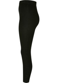 Sorte ribbede leggings med høy elastisk midjebånd, med en glatt tekstur og kroppsnær passform.