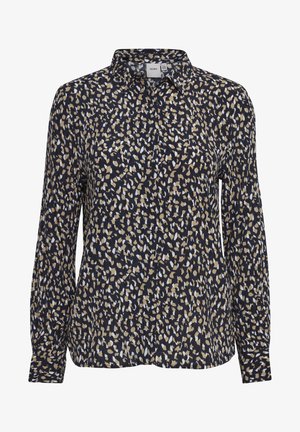 Laivan sininen paita, jossa on kauluskangas ja epäjärjestelmällinen beige-valkoinen kuvio. Pitkät hihat, joissa on nappikiinnitys.