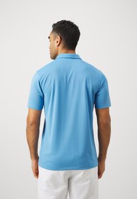Nike Performance SOLID - Poloshirts - blue beyond/white