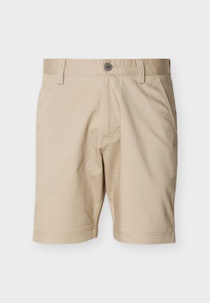 Beiget polven alle ulottuvat shortsit, joissa on napillinen kiinnitys, vyölenkit, sivutaskut ja siisti, sileä kangaspinta.