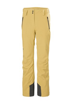 Pantaloni da sci impermeabili gialli con una vestibilità rilassata. Le caratteristiche includono due tasche con cerniera e dettagli neri alle caviglie. Materiale durevole.