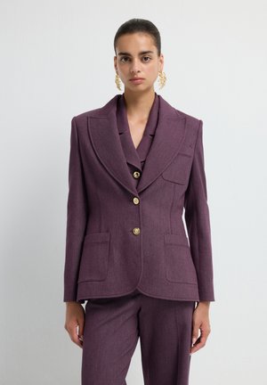 Purple tailored blazer made from textured fabric, featuring a wide lapel, two front pockets, and gold-tone buttons.