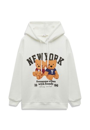 Hoodie blanc avec un graphisme sur le devant de deux ours en dessin animé portant des chemises colorées. Le texte indique "NEW YORK" et "Des vibrations géniales avec des amis."