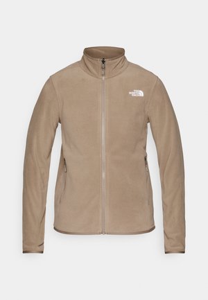 Beżowa polarowa kurtka z pełnym zamkiem błyskawicznym, kołnierzem stojącym, dwoma bocznymi kieszeniami na zamek oraz białym logo "The North Face" na lewej piersi.